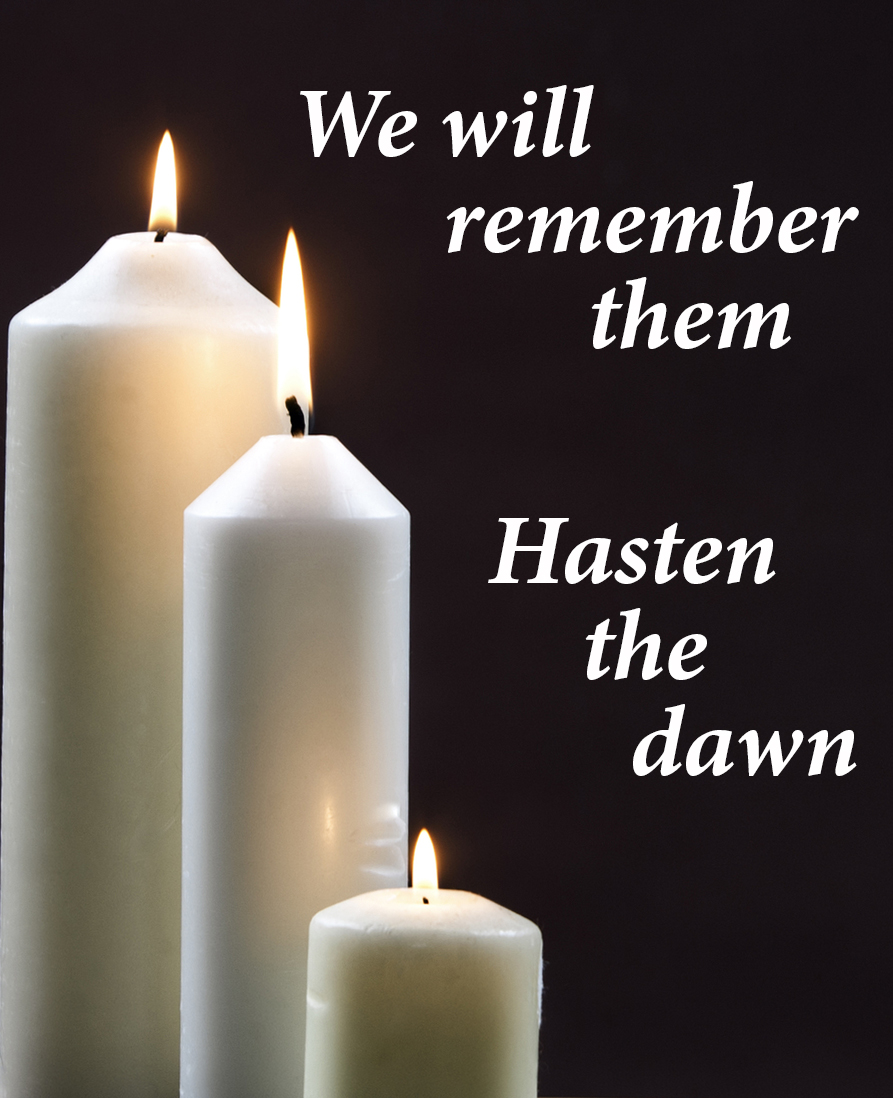 Three Candles against Dark Background